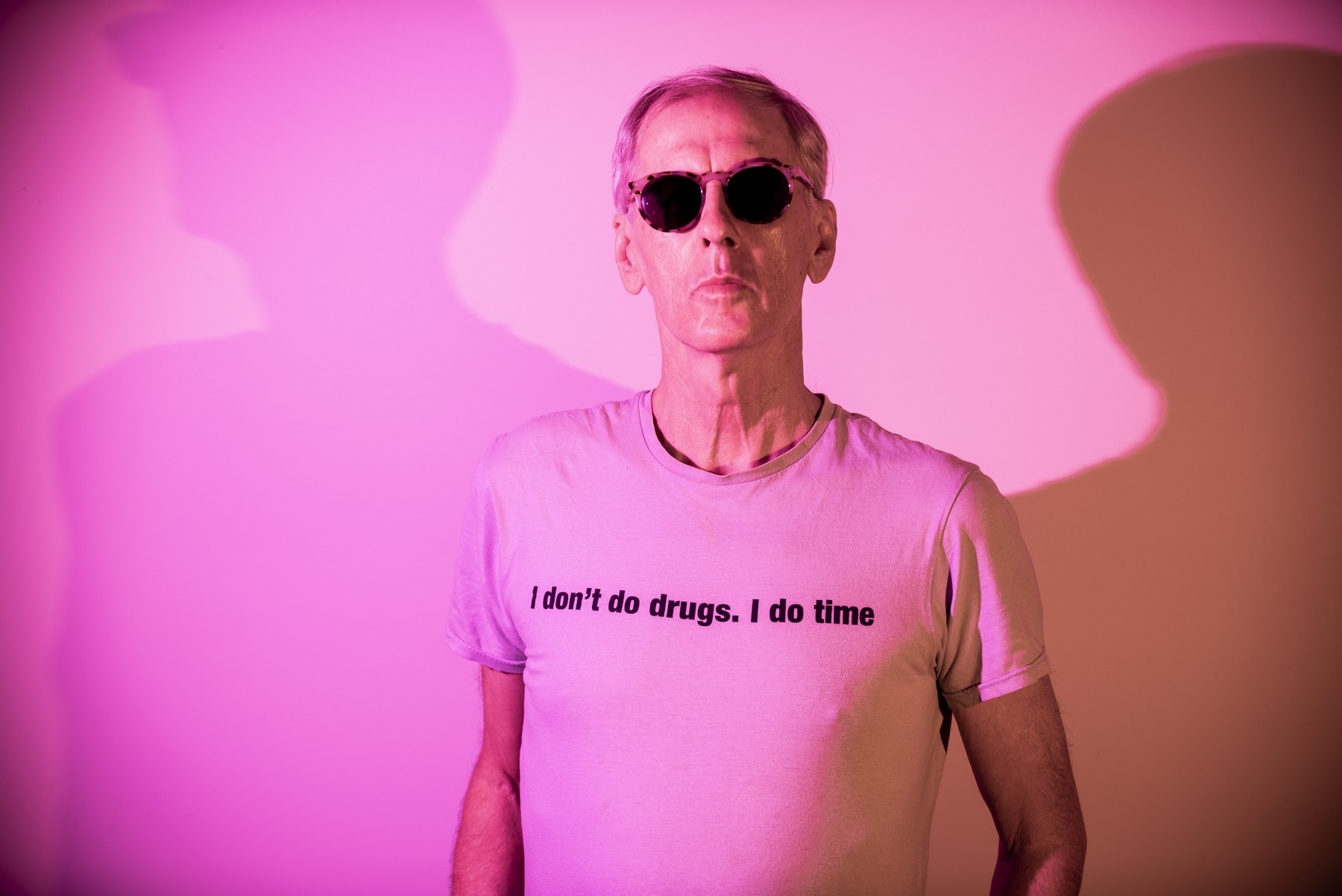 A photo of Robert Forster in t-shirt and sunglasses